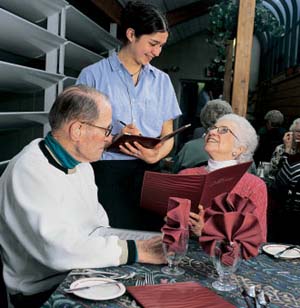 Eleutherios Papamechail and Jackie Neary placing an order with Rebecca Wellington